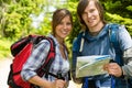 Portrait of trekking couple checking the map