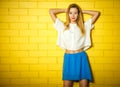 Portrait of Trendy Hipster Girl at the Brick Wall