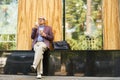 Trendy Senior Man Relaxing in Street Royalty Free Stock Photo