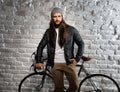 Portrait of trendy urban man with bicycle
