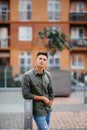 Portrait of a trendy young man in the city street Royalty Free Stock Photo