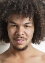 Portrait of a trendy young man with curly hair over white background