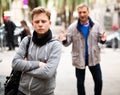 Troubled teen boy with man stranger scolding him Royalty Free Stock Photo