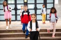 Tweenager girl with backpack walking after lessons Royalty Free Stock Photo