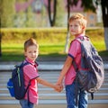 Portrait two adorable boys with backpack near pedestrian crossin. Royalty Free Stock Photo