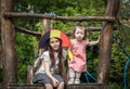Portrait of two girls in a Belgian flag hat in the park. Royalty Free Stock Photo