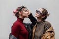 portrait of two beautiful fashionable girlfriends girls in youth style with sunglasses in cool vintage leather jacket with knitted Royalty Free Stock Photo