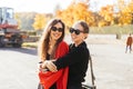 Portrait two beautiful happy girlfriends in the park. Royalty Free Stock Photo