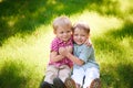 Portrait of two boys embracing and laughing outdoors Royalty Free Stock Photo