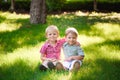 Portrait of two boys embracing and laughing outdoors Royalty Free Stock Photo