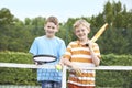 Portrait Of Two Boys Playing Tennis Together Royalty Free Stock Photo