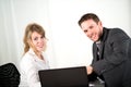 Portrait of two business people working together in office with computer Royalty Free Stock Photo