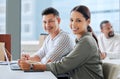 Another business day off to a good start. Portrait of two businesspeople working in an office. Royalty Free Stock Photo