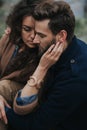 Portrait of two caucasian lovers. Young couple is hugging on autumn day outdoors. A bearded man and curly woman in love. Valentine Royalty Free Stock Photo