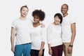 Portrait of two cheerful young couples in casuals standing together over white background