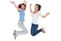 Portrait of two cheerful young female friends jumping Royalty Free Stock Photo