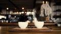 Portrait of two coffee cups freshly made and steaming on boards in trendy cafe