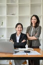 Portrait, Two confident, successful Asian businesswomen in business suits are at the office desk Royalty Free Stock Photo