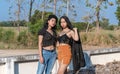 Portrait of two confident women wearing fashion clothes looking at camera Royalty Free Stock Photo
