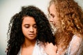 Portrait of two curly girls. Afro and blond Royalty Free Stock Photo