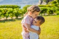 Portrait of two cute adorable baby children toddlers hugging and kissing each other, love friendship in childhood Royalty Free Stock Photo