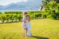 Portrait of two cute adorable baby children toddlers hugging and kissing each other, love friendship in childhood Royalty Free Stock Photo