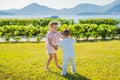 Portrait of two cute adorable baby children toddlers hugging and kissing each other, love friendship in childhood Royalty Free Stock Photo