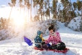 Portrait of two cute adorable little playful children wearing warm snow jacket enjoy having fun playing at park outdoors Royalty Free Stock Photo