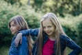 Portrait of two cute little girls enjoying summer outdoors. Royalty Free Stock Photo