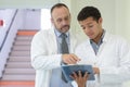 portrait two doctors with clipboard in hospital Royalty Free Stock Photo