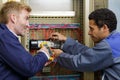 portrait two electricians measuring voltage Royalty Free Stock Photo