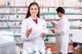 Portrait of two friendly pharmacists working