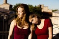 Portrait of two girlfriends on the roof Royalty Free Stock Photo