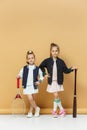 Portrait of two girls as tennis players holding tennis racket. Studio shot. Royalty Free Stock Photo