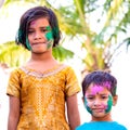 Portrait of Two girls having colours on their faces