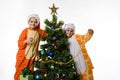 Portrait of two girls in pajamas near the Christmas tree Royalty Free Stock Photo