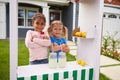 Portrait Of Two Girls Running Homemade Lemonade Stand Royalty Free Stock Photo