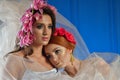 Portrait of the two gorgeous ladies with wild flowers. Elegance.  Wreaths  Fantasy Royalty Free Stock Photo