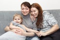 Portrait of two happy adults and little child Royalty Free Stock Photo