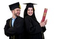 Portrait of two happy graduating arabic muslim students. Isolated over white background.