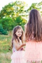 Portrait of Two Happy little girls having fun and embracing at