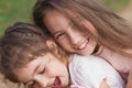 Portrait of Two Happy little girls laughing and hugging at the summer park. Happy childhood concept Royalty Free Stock Photo