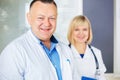 Portrait of two happy mature doctors. Royalty Free Stock Photo