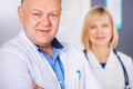 Portrait of two happy mature doctors. Royalty Free Stock Photo