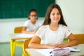 Portrait of two happy schoolgirls in a classroom Royalty Free Stock Photo
