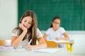 Portrait of two happy schoolgirls in a classroom Royalty Free Stock Photo