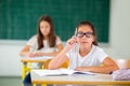 Portrait of two happy schoolgirls in a classroom Royalty Free Stock Photo