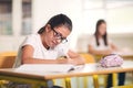 Portrait of two happy schoolgirls in a classroom Royalty Free Stock Photo