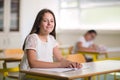 Portrait of two happy schoolgirls in a classroom Royalty Free Stock Photo