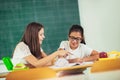 Portrait of two happy schoolgirls in a classroom Royalty Free Stock Photo